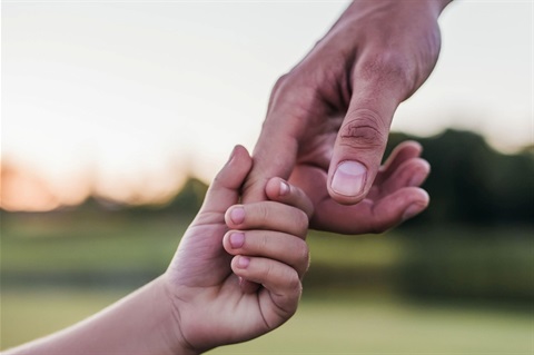 Dad holding child's hand.jpg