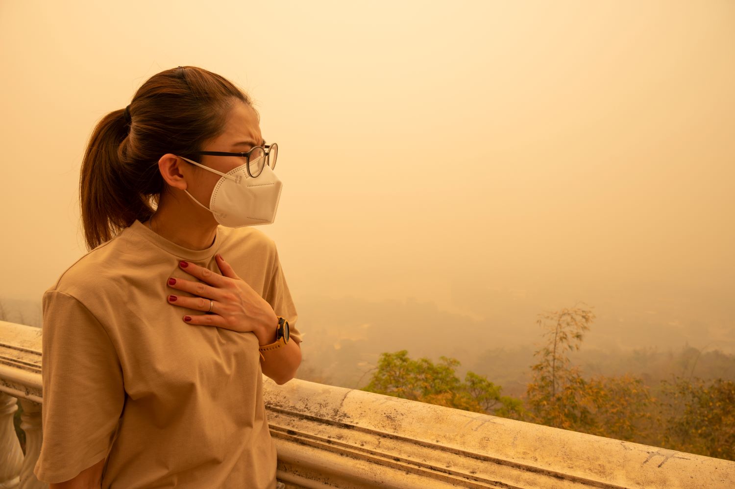 Woman wearing mask in smoke