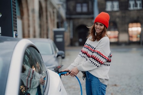 woman-charging-electric-vehicle.jpg