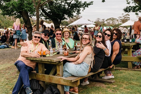 Group of people around an outdoor table